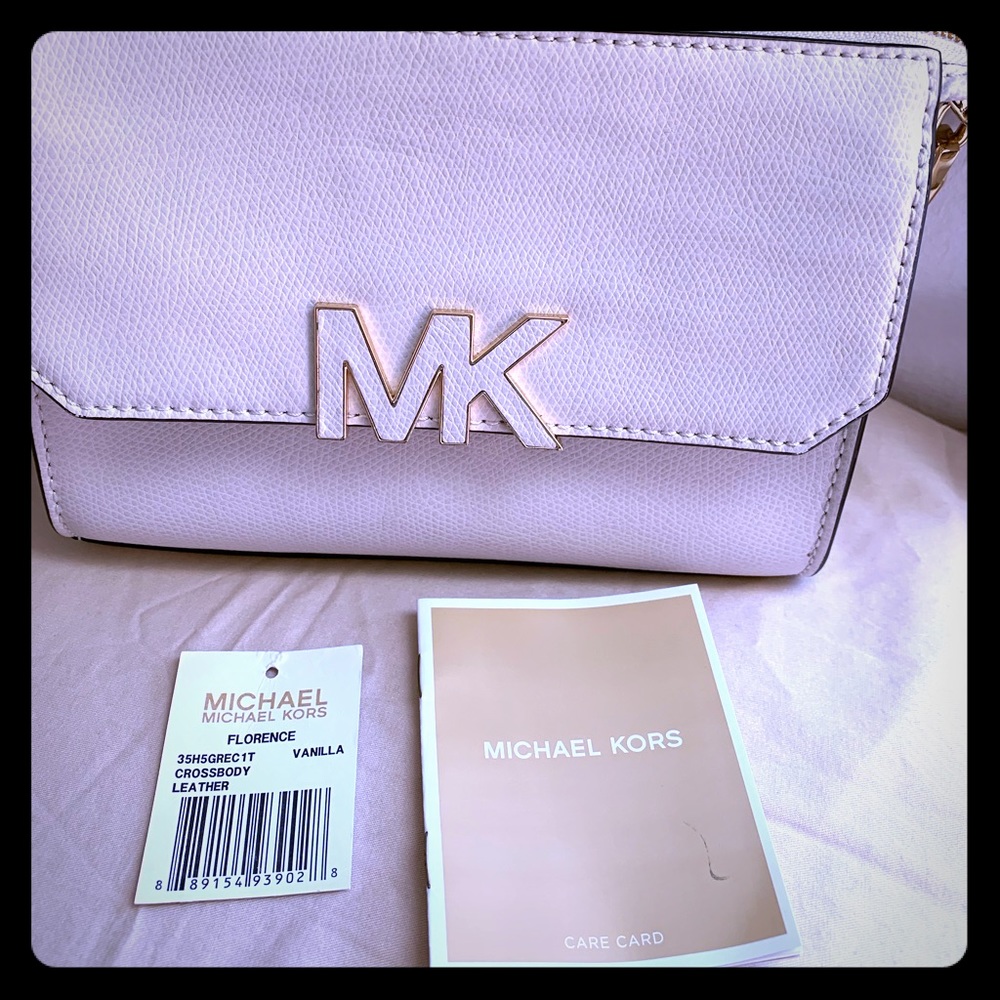 Michael Kors Vanilla Florence Crossbody Chain link attached to leather strap.